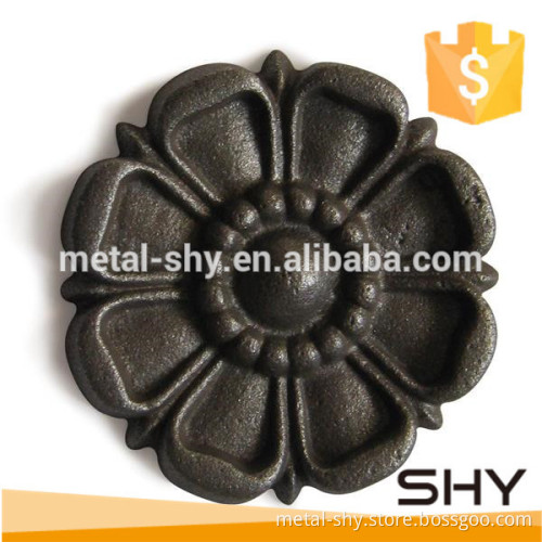 ornamental cast iron rosette as fence decoration